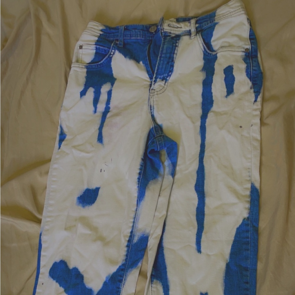 White and blue tie-dye said Jeans